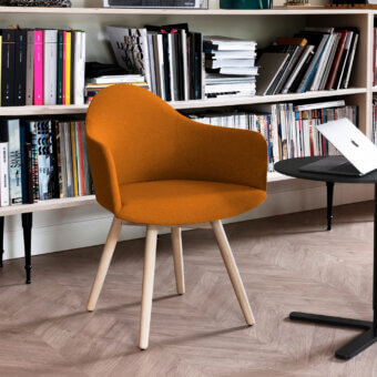 Distinguished Lapalma Edit armchair with a rigid Baydur® shell upholstered in golden-yellow textile and splayed solid ash legs with a varnished finish