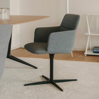 Superior Lapalma Foil armchair crafted in medium gray textile with a matte black powder-coated aluminum swivel base