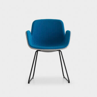 Distinguished Lapalma Pass armchair with fully padded form upholstered in vibrant blue textured textile and matte black metal base