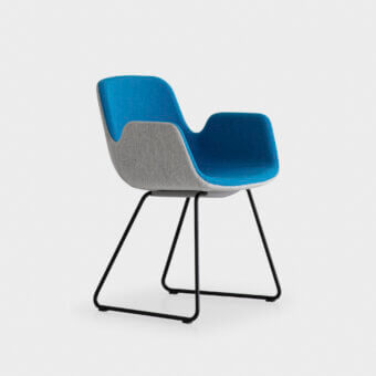 Exceptional Lapalma Pass armchair with fully padded construction upholstered in vibrant blue and sophisticated gray textiles with matte black metal base