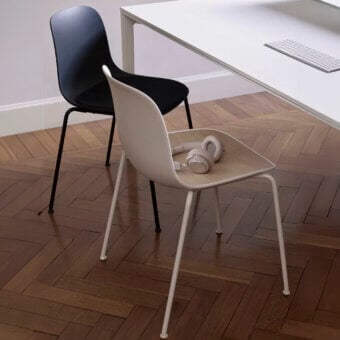 Sophisticated Lapalma Seela chair with organically curved form in pale beige and matte synthetic shell built with light metal legs