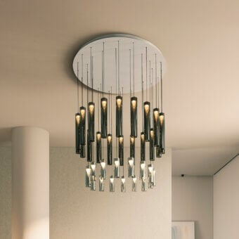 Cassoni iconica suspension lamp, brushed silver canopy, dark cylindrical shades, black rods, layered LED light, modern sculptural design.
