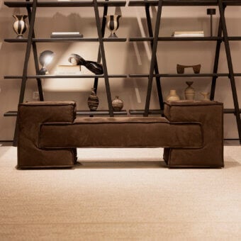 Distinguished Verzelloni Reef bench with textured deep brown cotton fabric upholstery and recessed black lacquered beech wood feet