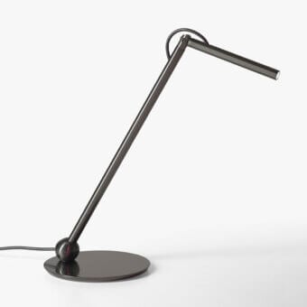 Distinguished Oluce Calamaio table lamp crafted of metal with a glossy dark gray lacquer finish and adjustable head