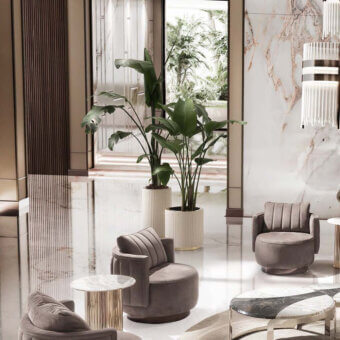 Hollywood planter, ribbed ceramic, cylindrical form, between gray velvet armchairs and marble side table in modern interior scene.