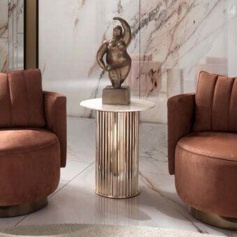 Elegant DV Home Collection Windsor side table with luminous onyx top and vertically ribbed polished stainless steel base