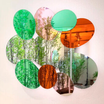 Exceptional Glas Italia Bouquet mirror with ten irregular ovoid forms in green, orange, and pale pinkish-purple glossy glass crafted in Italy