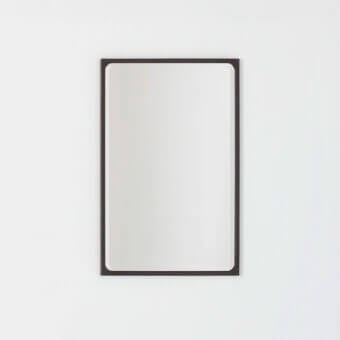 Elegant Glas Italia Como mirror in shiny-polished untreated solid brass with a beveled perimeter and dark brown finish