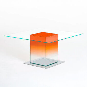 Superior Glas Italia Donald table crafted in laminated extralight glass and mirror-polished stainless steel with an orange gradient finish