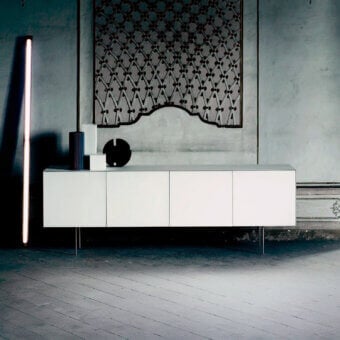 Distinguished Glas Italia Magic Box sideboard built with glossy lacquered glass and slim chromed metal legs in white finish