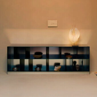 Elegant Glas Italia Obliquo sideboard crafted from laminated glass with a shiny polished edge and teal mirrored exterior