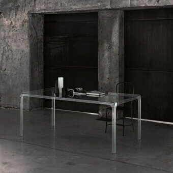 Exceptional Glas Italia Oscar table with transparent tempered glass and light-colored metal supporting a glossy finish