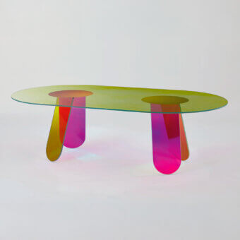 Elegant Glas Italia Shimmer table crafted from laminated and glued glass with iridescent multichromatic finish and organically sculpted legs transitioning from yellow to magenta