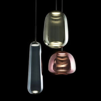 Pendant lights, glass and ribbed texture, teardrop, rounded, olive-green, pink tones, warm glow, black background, Melogranoblu Cassoni.