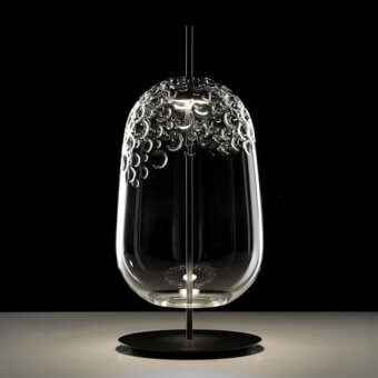 Distinguished melogranoblu Galuchat lamp with transparent hand-blown glass and dark grey varnished metal exhibiting an irregular textured finish