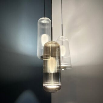 Distinguished melogranoblu Piero suspension lamp crafted in handblown glass with warm amber ribbed finish and dual light source