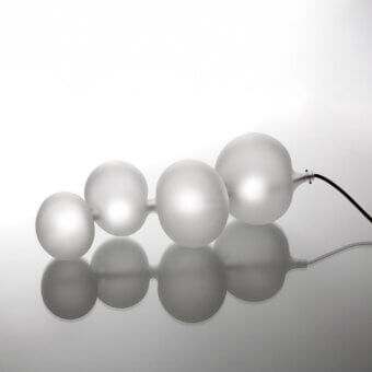 Elegant melogranoblu Serendipity lamp with flowing frosted glass spheres and muted off-white illumination