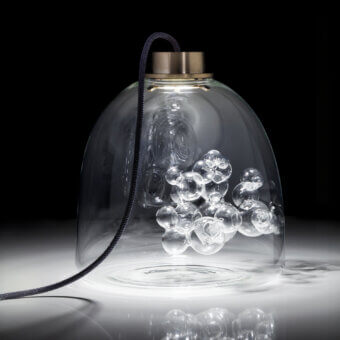 Exclusive melogranoblu Soap table lamp with a hand-blown transparent glass sphere and gilded accents, exhibiting a glossy finish