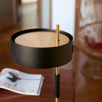 Refined Oluce 1953 lamp crafted in polished gold-tone metal with a translucent glass cylindrical shade