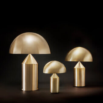 Distinguished Oluce Atollo Metal Table Lamp with a warm neutral beige form and glossy polished metal finish