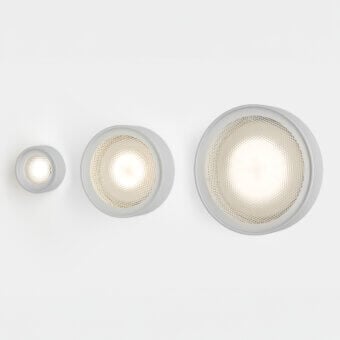 Oluce Berlin Out wall ceiling lamps, light gray metal, circular frosted glass diffusers arranged by size, diamond texture, studio shot.
