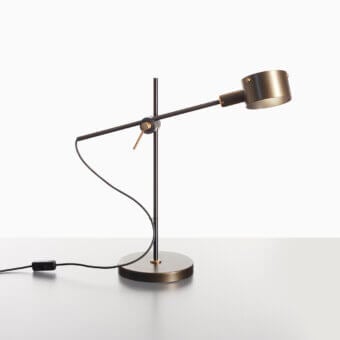 Distinguished Oluce G.O table lamp crafted in metal with a warm bronze finish and satin detailing