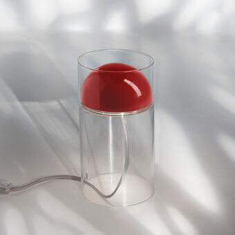 Distinguished Oluce Medusa lamp crafted in clear glass with a glossy vibrant red shade and descending metallic cord