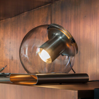 Superior Oluce Globe Table Lamp with transparent blown-glass and satin-finish metal in warm amber and bronze hues