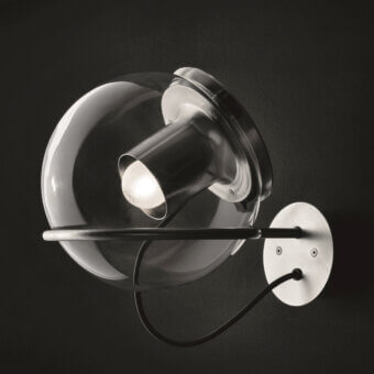 Superior Oluce Globe wall lamp crafted in Italy with a transparent blown-glass globe and satin metal reflector