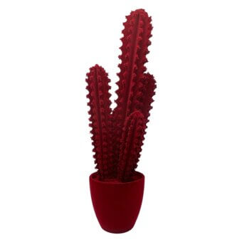 Artificial cactus, burgundy color, two upright stalks with textured protrusions in a rounded matte pot against a white backdrop.