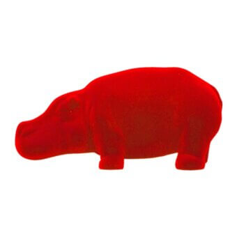 Red velvet hippo figurine with rounded form and short legs against a white backdrop, displaying a textured, saturated color.