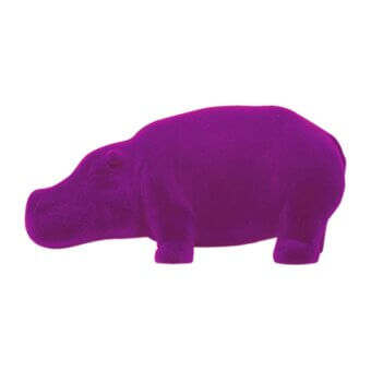 Purple hippo figurine, stylized sculpture with matte velvety texture, rounded form, short tail, and small dark eyes against a white backdrop.