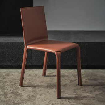 Elegant Bontempi Alice chair upholstered in reddish-brown hide leather with sleek linearity and expertly crafted stitching