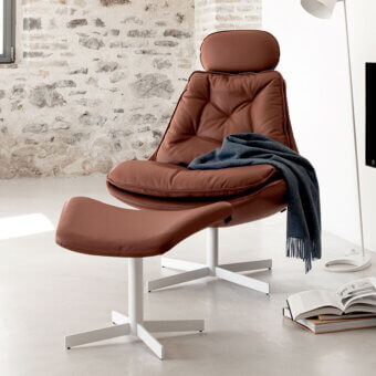 Superior Bontempi Daya swivel lounge chair in reddish-brown leather with quilted detail and sleek white metal base