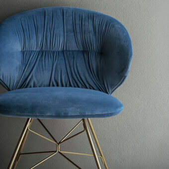 Distinctive Bontempi Drop chair with deep blue velvet textile upholstery and gold-toned metal spider base