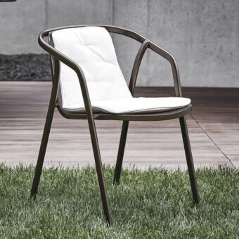 Refined Bontempi Ines chair with enveloping form crafted in matte dark metal and soft white textured textile for indoor or outdoor use