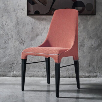 Distinguished Bontempi Kelly chair upholstered in muted coral textile with a dark matte-finished wood frame