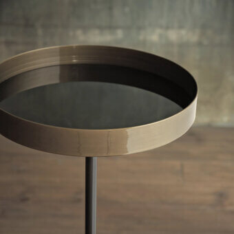 Bontempi Lift side table, brass and black metal, circular tabletop with gradient rim and cylindrical leg, minimalist design.