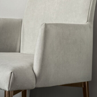 Distinguished Bontempi Mila chair with gently curved form in matte light gray textile and warm brown wooden frame