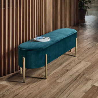 Elegant Bontempi Puffoso bench with deep teal velvet upholstery and gleaming brass-toned metal legs
