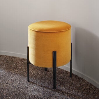 Superior Bontempi Puffoso ottoman with cylindrical form upholstered in golden yellow textured textile and dark-toned metal legs