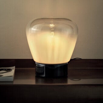 Distinguished Bontempi Stone table lamp with beautifully blown white glass shade and dark gray base crafted in Italy