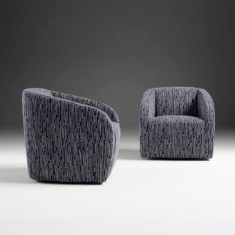 Distinguished Egoitaliano Carlotta lounge chair with dark navy geometric textile upholstery and tubular steel swivel base