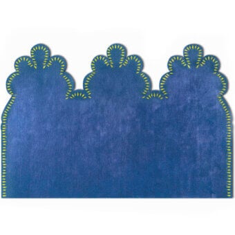 Distinguished Egoitaliano Merlino rug with deep blue wool and vibrant yellow stitching, exhibiting a textured matte finish