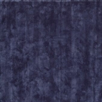 Exceptional Egoitaliano Petra rug with deep navy cotton and breathable tencel offering a remarkably soft textured surface