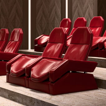 Distinctive Mascheroni Jurij home cinema seating crafted in glossy red leather with a curved birch and steel frame