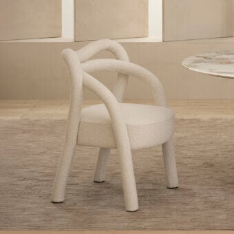 Exceptional Rugiano Abbraccio armchair in neutral beige woven fabric with bronzed brass details and continuously looping armrests