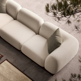 Captivating Rugiano Amalfi sofa with warm stained mahogany, chrome details, and textured matte light beige fabric