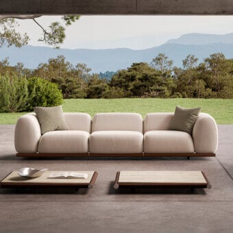 Exclusive Rugiano Amalfi sofa with stained mahogany, chrome details, and light beige outdoor fabric upholstery