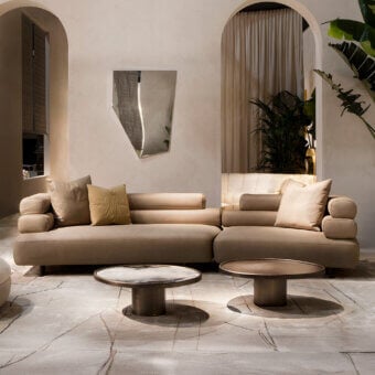 Exceptional Rugiano Bali sectional with organically curved form upholstered in warm neutral beige textile and bronzed brass details